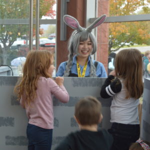 kids playing with actor